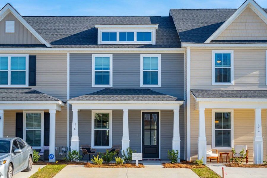 Front exterior of a home in the Abbey Walk Townhomes community, located in Moncks Corner, SC (Image 3).