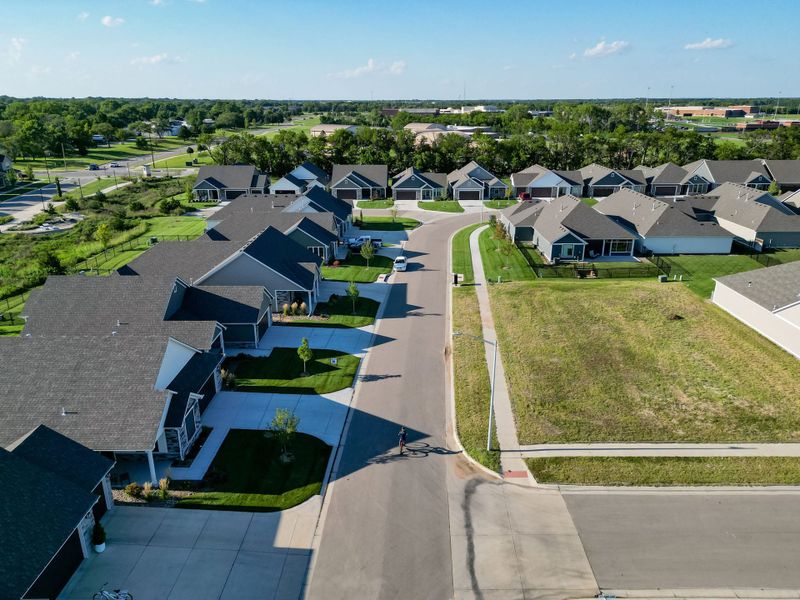 Aerial view of the The Courtyards at The Heritage community in Andover, KS, showing layout and nearby surroundings (Image 29). Aerial view of the The Courtyards at The Heritage community in Andover, KS, showing layout and nearby surroundings (Image 29).