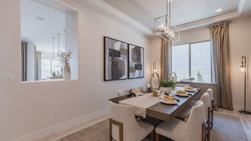 Experience elevated dining with chic lighting, abstract art, and refined furnishings in Windrose.