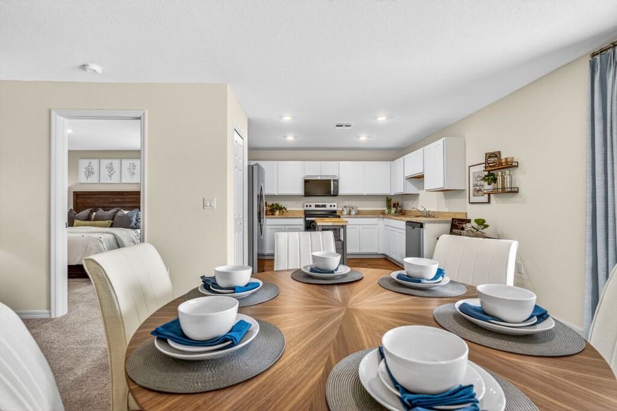 Furnished interior in a model home at Mallard Landing in Okeechobee (Image 5).