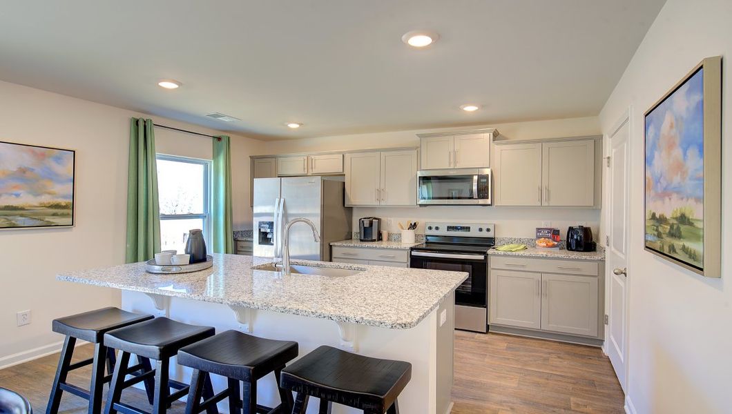 Furnished interior in a model home at Wildbrook Village in Waynesville (Image 2).