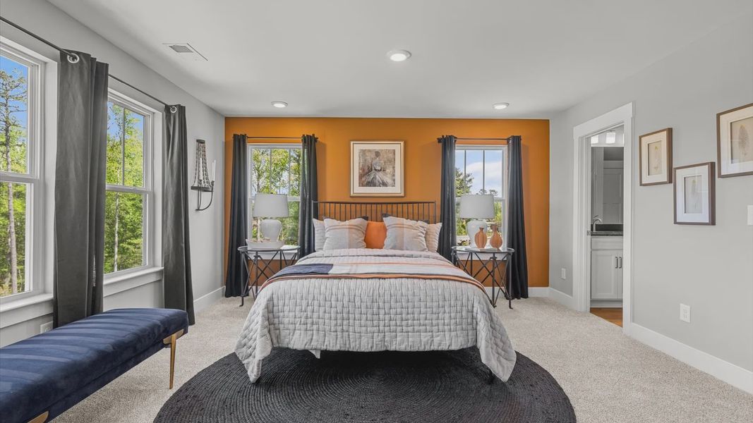 Spartanburg, SC two story townhome modern primary suite with large windows and plush carpet at Tyger Ridge Spartanburg, SC two story townhome modern primary suite with large windows and plush carpet at Tyger Ridge