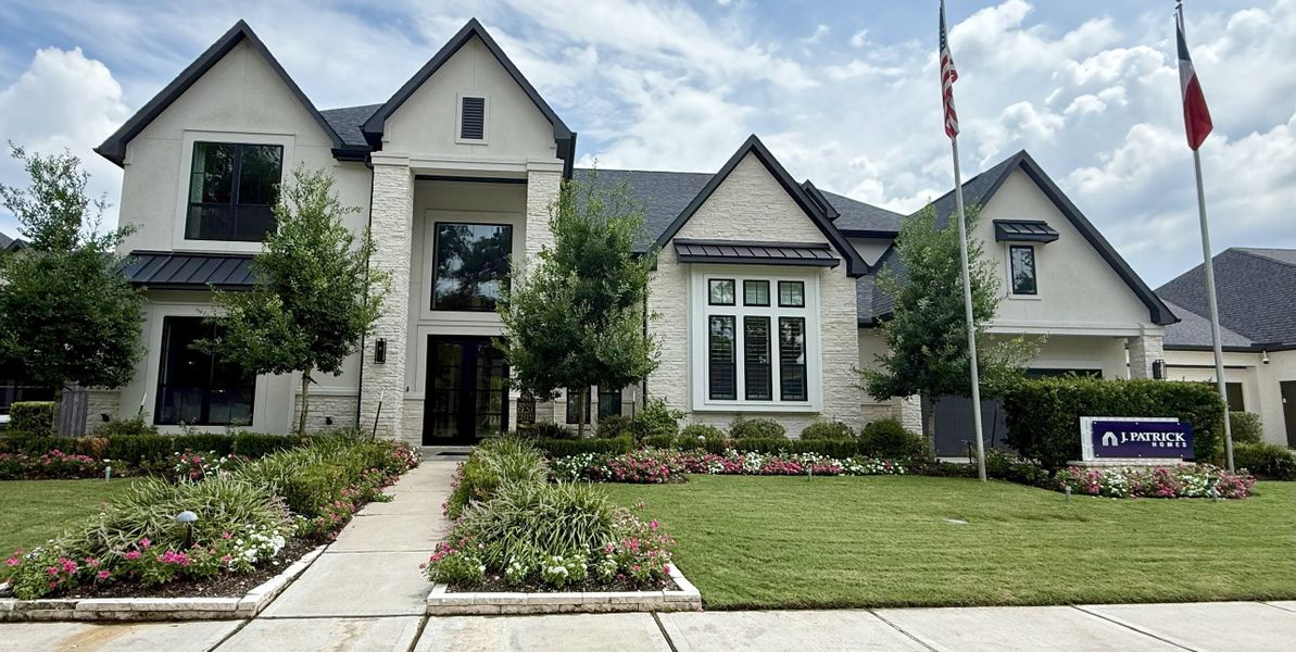 A beautiful modern home with a manicured lawn and garden in Sienna 90' Lots by J. Patrick Homes (Missouri City, TX). A beautiful modern home with a manicured lawn and garden in Sienna 90' Lots by J. Patrick Homes (Missouri City, TX).