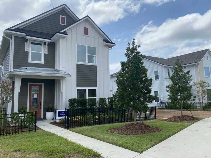 A charming two-story home with modern siding and a landscaped yard in Granville at eTown 34' by David Weekley Homes (Jacksonville, FL). A charming two-story home with modern siding and a landscaped yard in Granville at eTown 34' by David Weekley Homes (Jacksonville, FL).