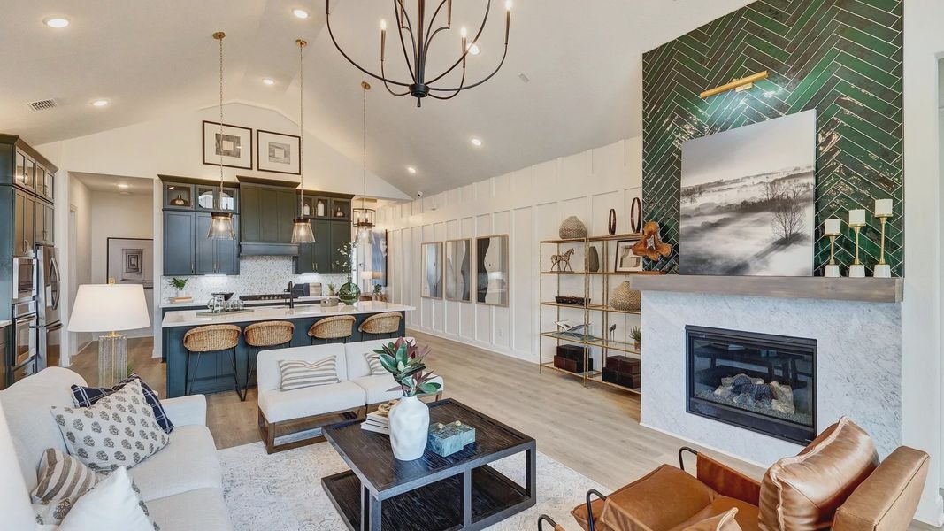 Opulent green herringbone fireplace, vaulted ceilings, chic lighting, Hawkes Landing.