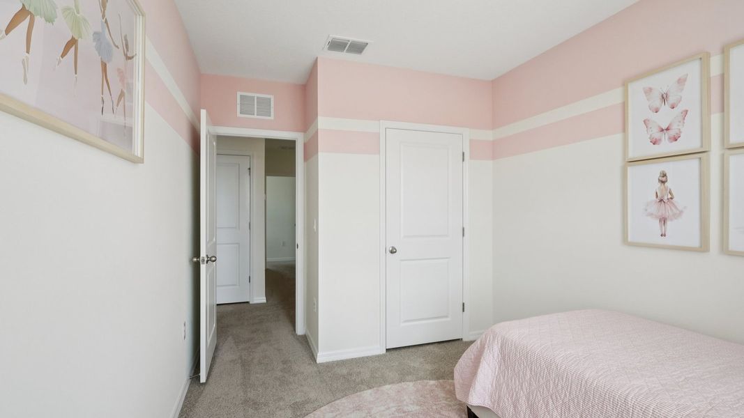 Furnished interior in a model home at Towns at Woodsdale in Wesley Chapel (Image 20).