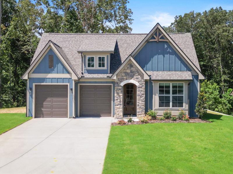 Front exterior of a home in the Nature's Cove community, located in Ooltewah, TN (Image 1). Front exterior of a home in the Nature's Cove community, located in Ooltewah, TN (Image 1).