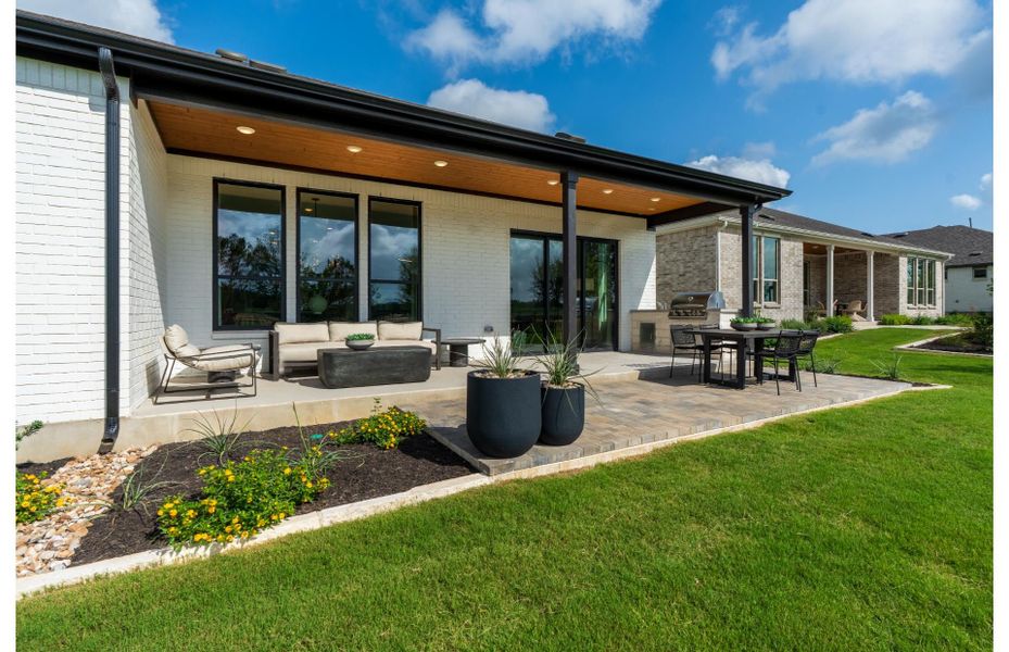 Beautiful outdoor living space with covered patio, perfect for entertaining or relaxing. Beautiful outdoor living space with covered patio, perfect for entertaining or relaxing.