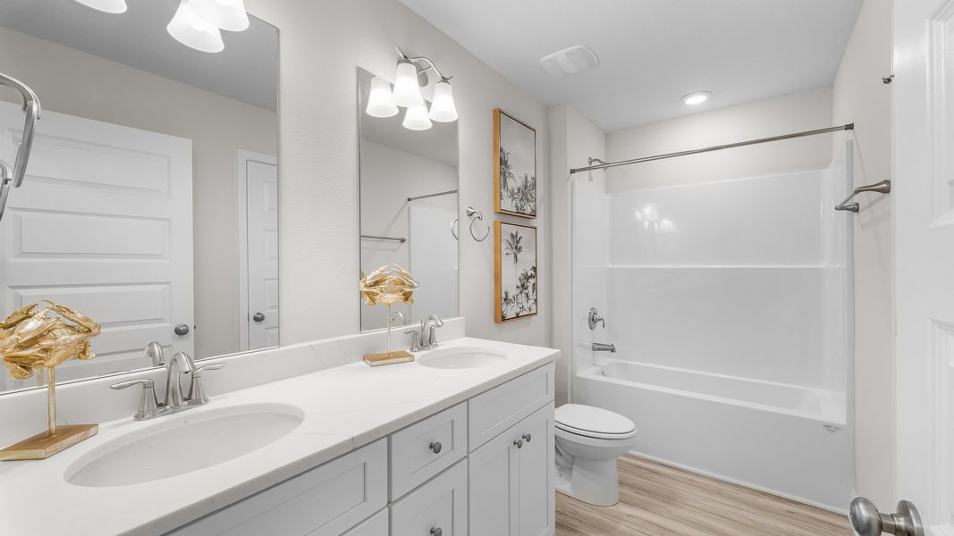 Furnished interior in a model home at WindMark Townhomes in Port Saint Joe (Image 25).