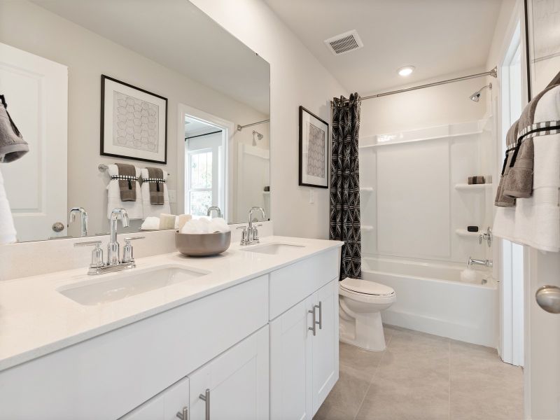 A dual entry bathroom connects the two bedrooms.