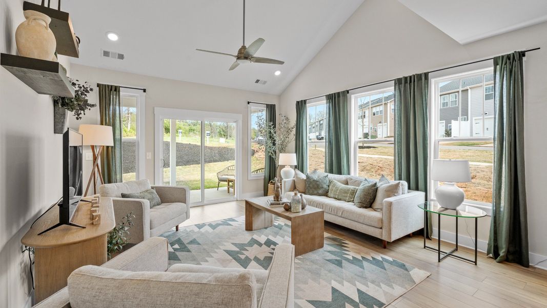 Hardwood flooring and high standards define this vibrant family room ideal for everyday living located in Fountain Inn, SC