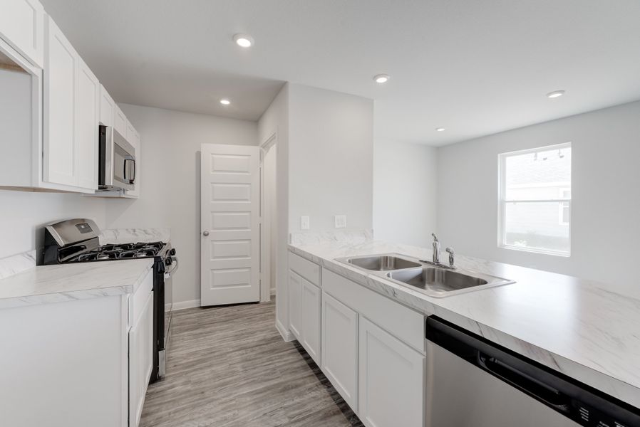 Furnished interior in a model home at Heather Heights in Itasca (Image 3).