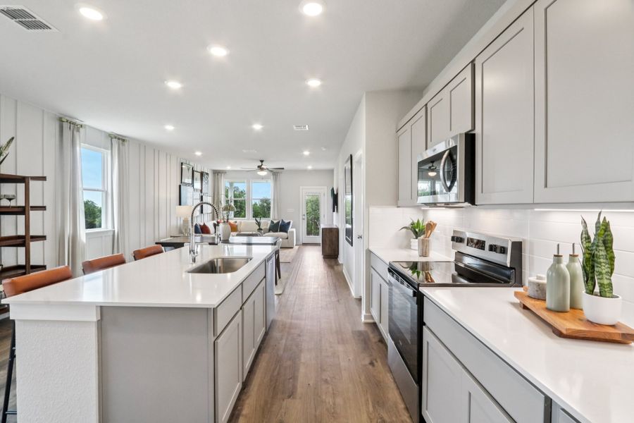 A kitchen with white cabinets. A kitchen with white cabinets.