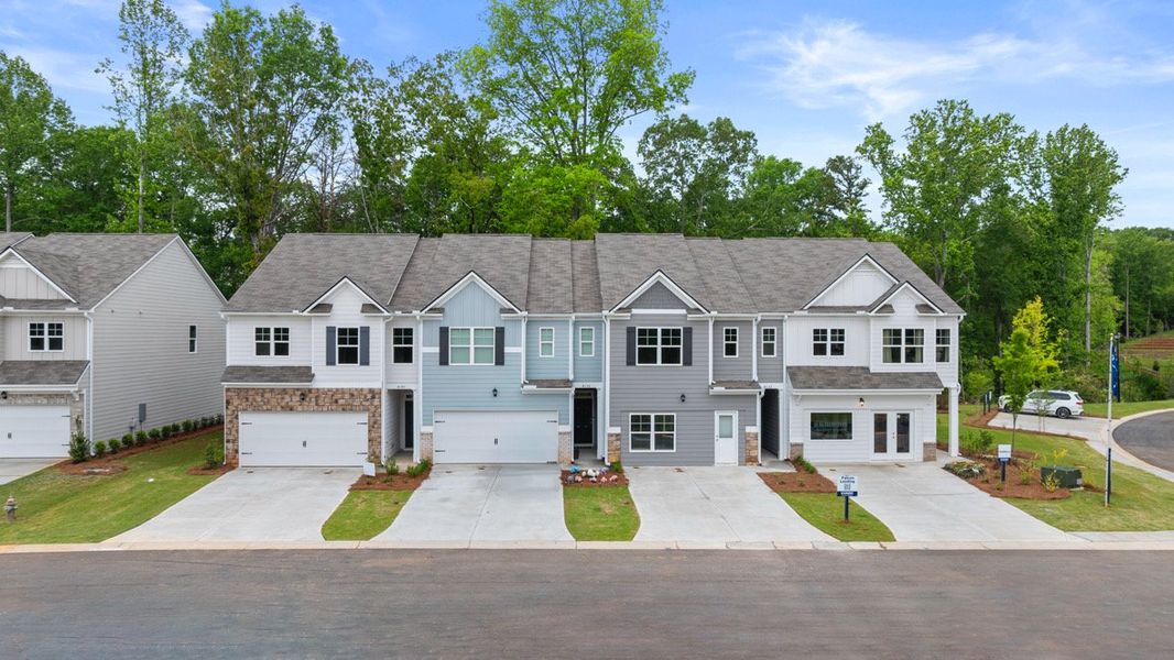 Front exterior of a home in the Falcon Landing Townhomes community, located in Gainesville, GA (Image 11).