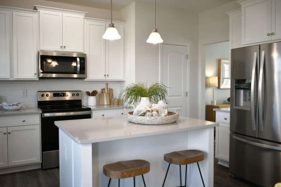 Furnished interior in a model home at Brassfield Meadows in Burlington (Image 40).
