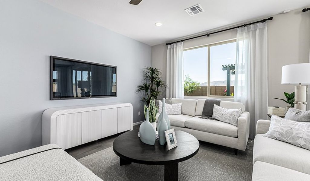 Furnished interior in a model home at Portfolio at White Tank Foothills in Waddell (Image 9).