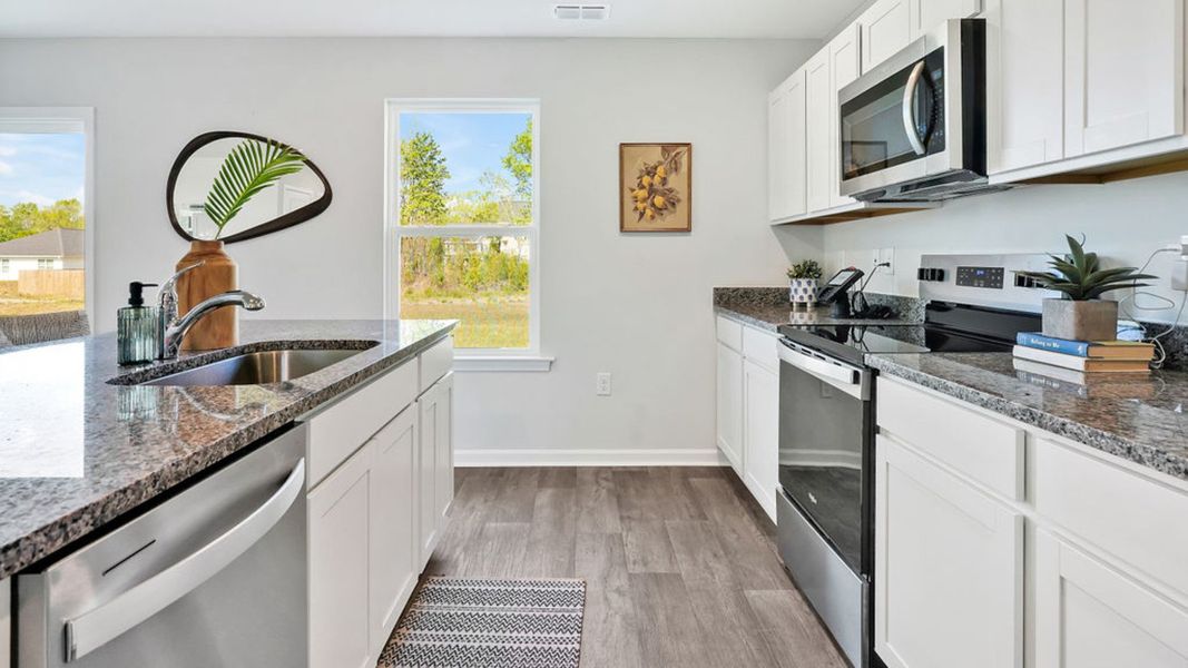 Furnished interior in a model home at Patriot Pointe at Towne Pointe in Jacksonville (Image 6).