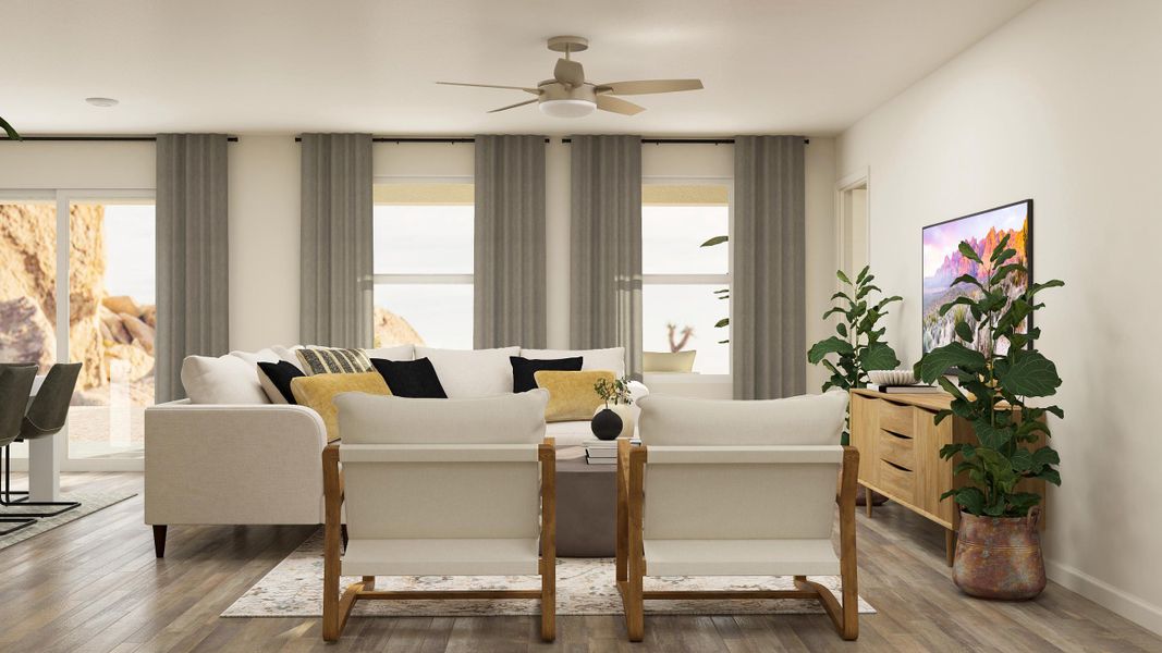 A living room with a white couch and a white table.
