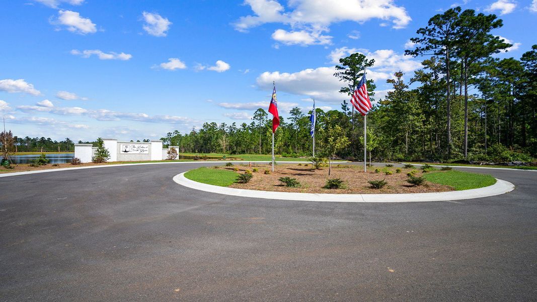 Entrance to the The Lakes at North Glynn community in Brunswick, GA, featuring signage and landscaping (Image 13).