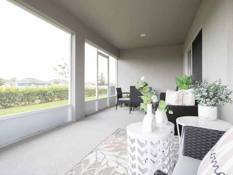 Your living area opens to outdoor living on your covered lanai - Serendipity model home in Winter Haven