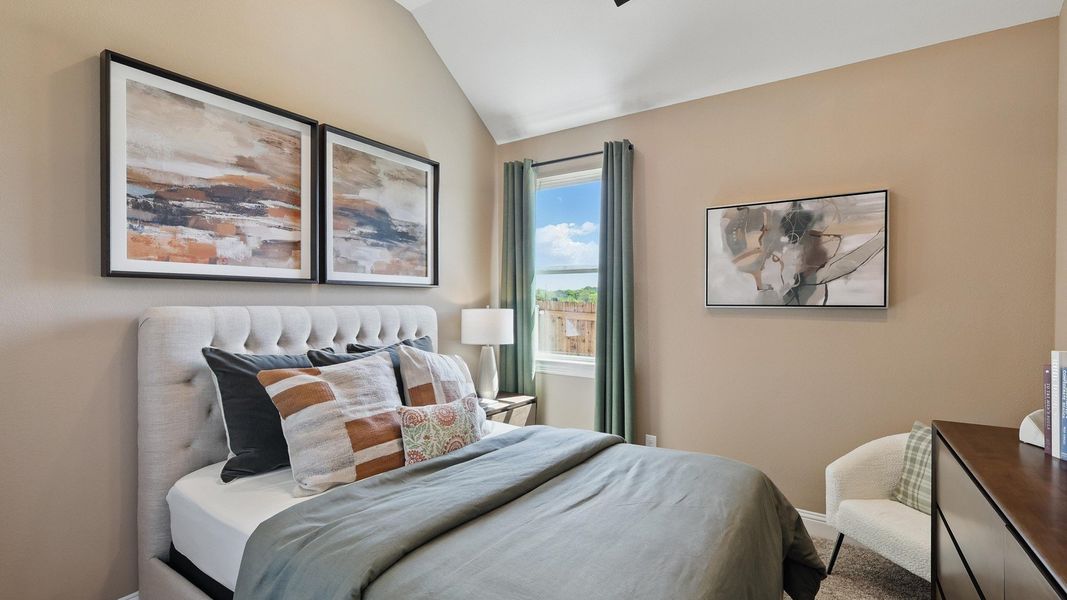 Vaulted ceilings and plush bedding highlight this Green Oaks Preserve bedroom's refined elegance. Vaulted ceilings and plush bedding highlight this Green Oaks Preserve bedroom's refined elegance.