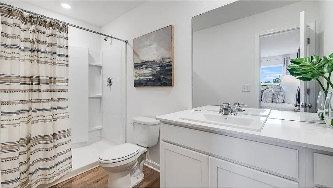 Furnished interior in a model home at Eagle's Ridge: Watermill in Pace (Image 5).