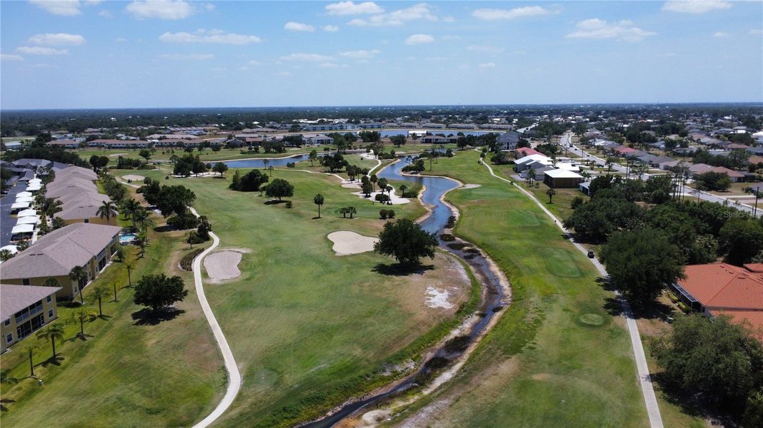 Aerial view of the Deep Creek community in Punta Gorda, FL, showing layout and nearby surroundings (Image 1).