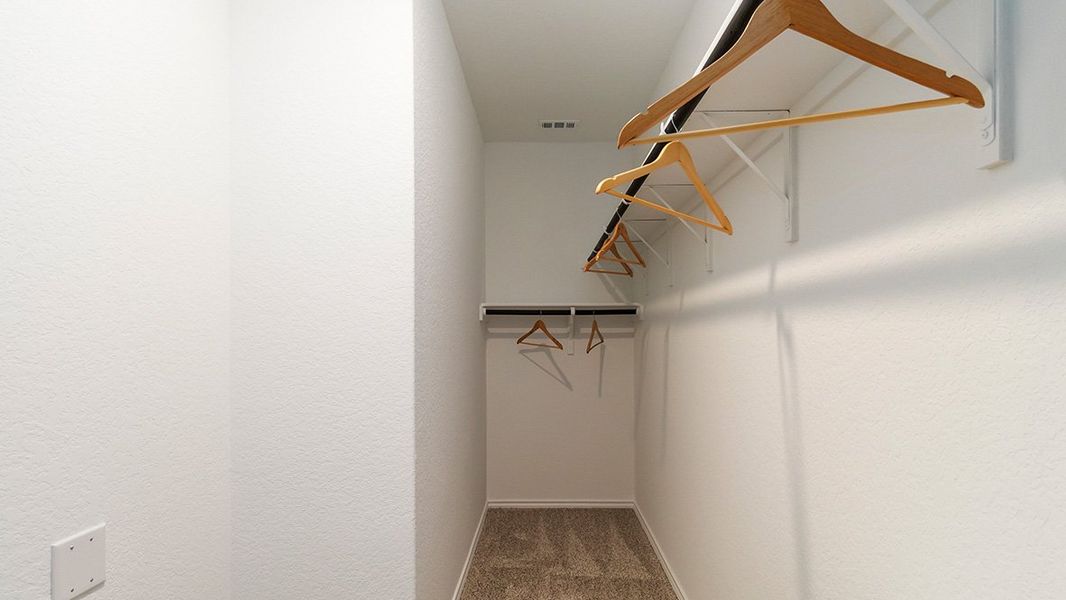 Furnished interior in a model home at Preserve at Medina in Von Ormy (Image 40).