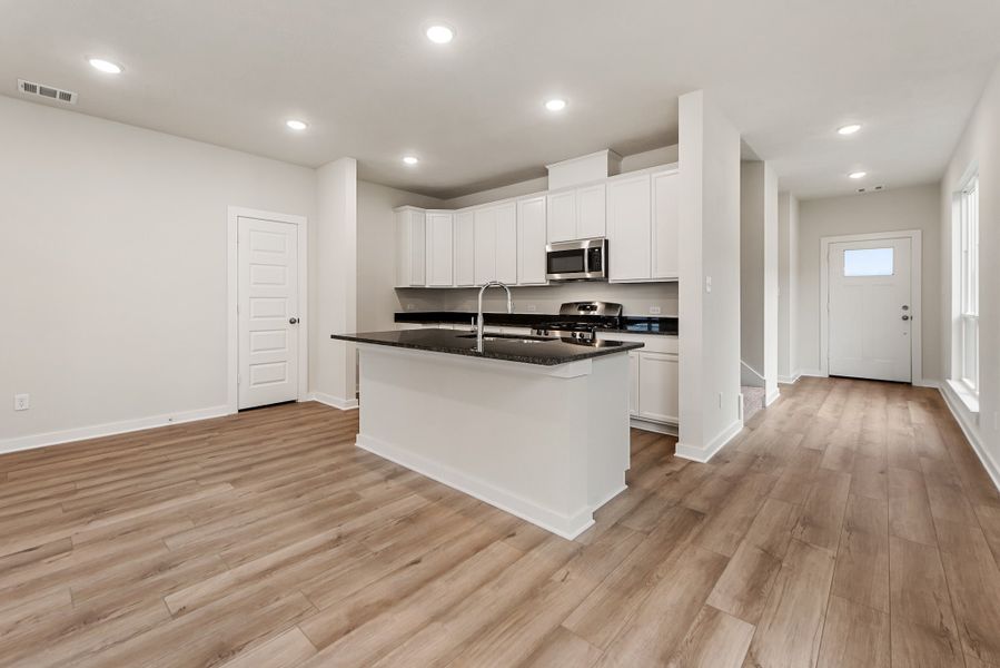 Furnished interior in a model home at Heartland at Vintage Farms in Brenham (Image 8).
