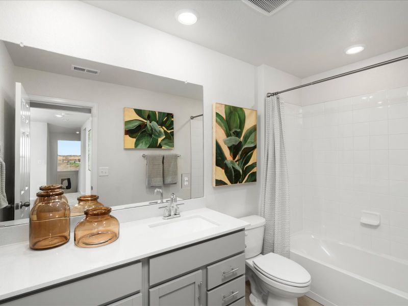 Furnished interior in a model home at Frontier Estates - The Trails Collection in Firestone (Image 13).