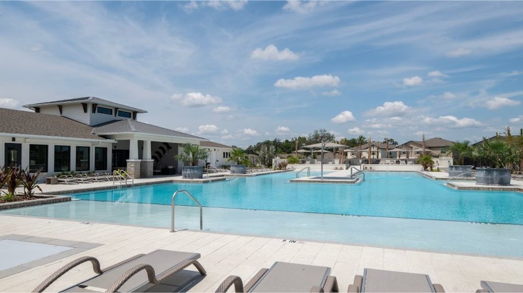 Front exterior of a home in the Abbott Square: The Townhomes community, located in Zephyrhills, FL (Image 7).