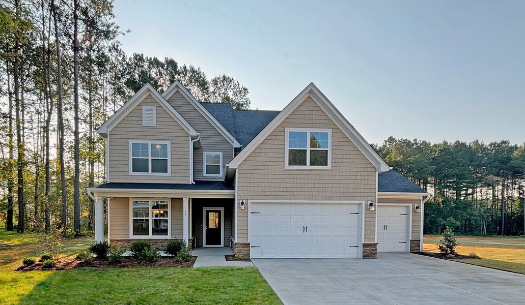 Front exterior of a home in the Magnolia Acres community, located in Fuquay Varina, NC (Image 15). Front exterior of a home in the Magnolia Acres community, located in Fuquay Varina, NC (Image 15).