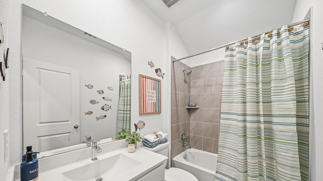 Furnished interior in a model home at Sunterra in Katy (Image 40).