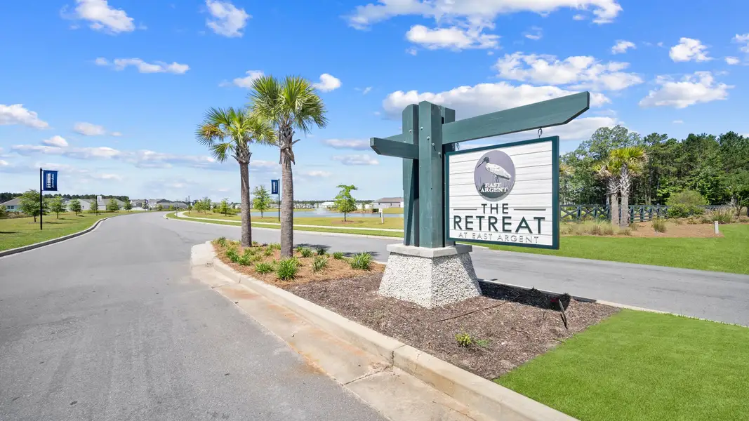 Entrance to the The Retreat at East Argent community in Ridgeland, SC, featuring signage and landscaping (Image 1).