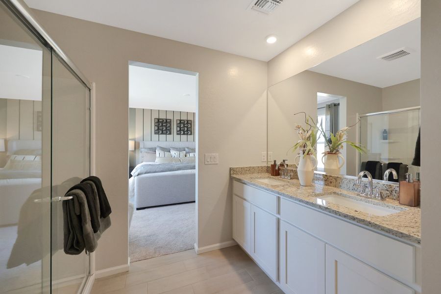A bathroom with a tub sink and a shower. A bathroom with a tub sink and a shower.