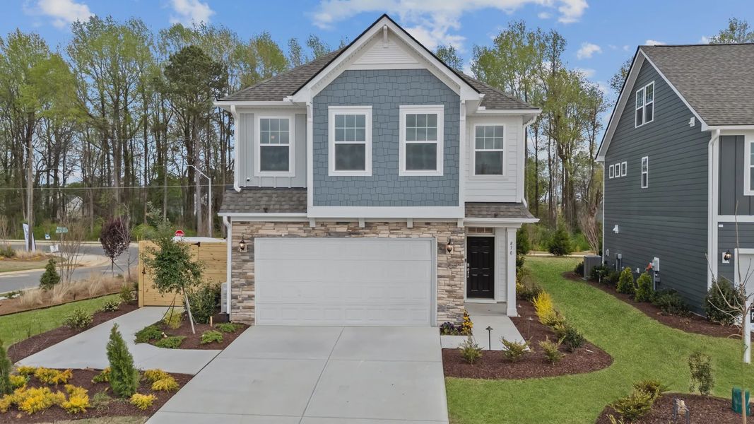 Front exterior of a home in the Station Pointe community, located in Angier, NC (Image 9). Front exterior of a home in the Station Pointe community, located in Angier, NC (Image 9).