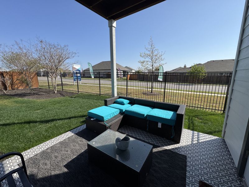 A cozy patio space with vibrant turquoise cushions and modern decor. A cozy patio space with vibrant turquoise cushions and modern decor.