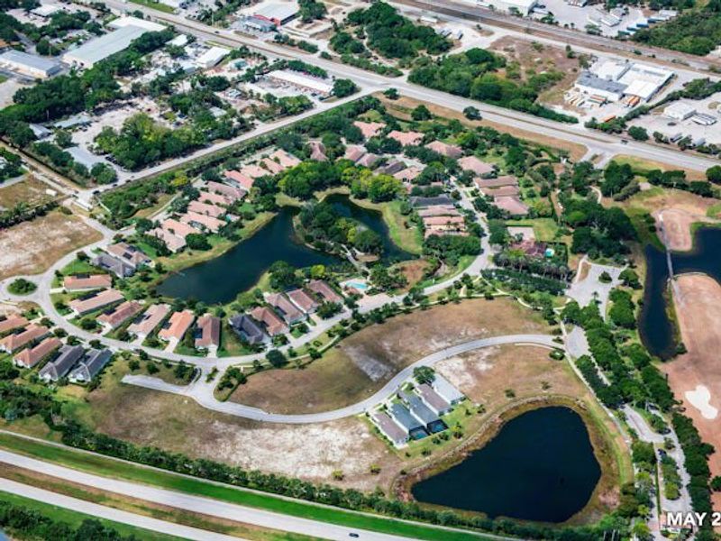 Aerial view of the The Falls at Grand Harbor community in Vero Beach, FL, showing layout and nearby surroundings (Image 30).