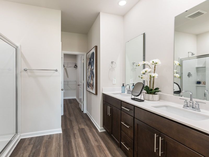 The ensuite bath features dual sinks and a large walk-in closet.