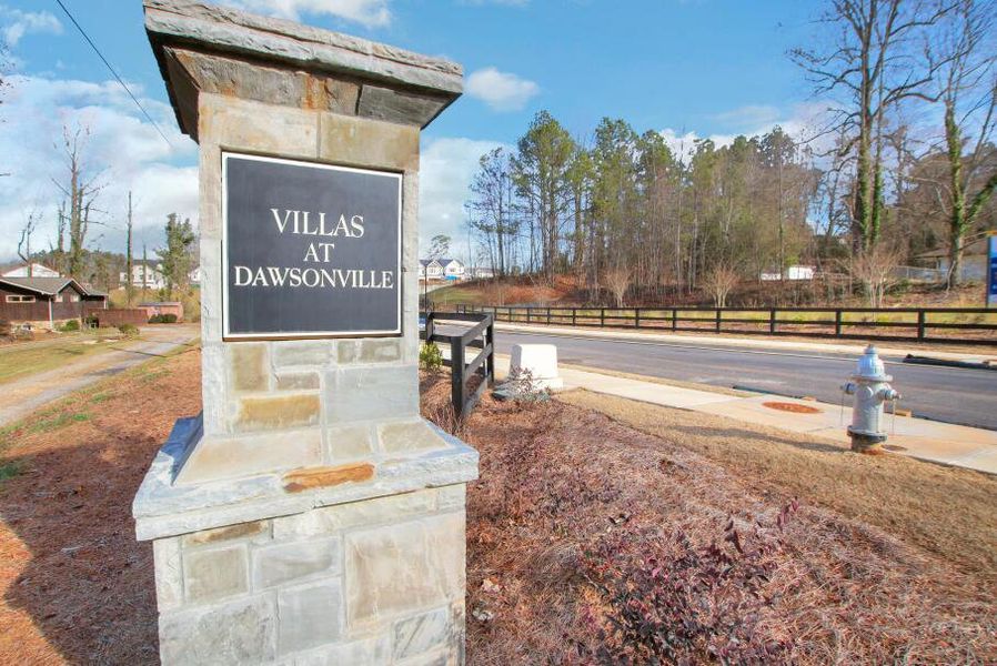 Entrance to the Villas at Dawsonville Townhomes community in Dawsonville, GA, featuring signage and landscaping (Image 2). Entrance to the Villas at Dawsonville Townhomes community in Dawsonville, GA, featuring signage and landscaping (Image 2).