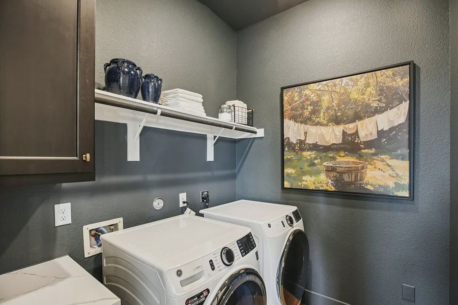 Furnished interior in a model home at Meridiana 50's in Manvel (Image 30).