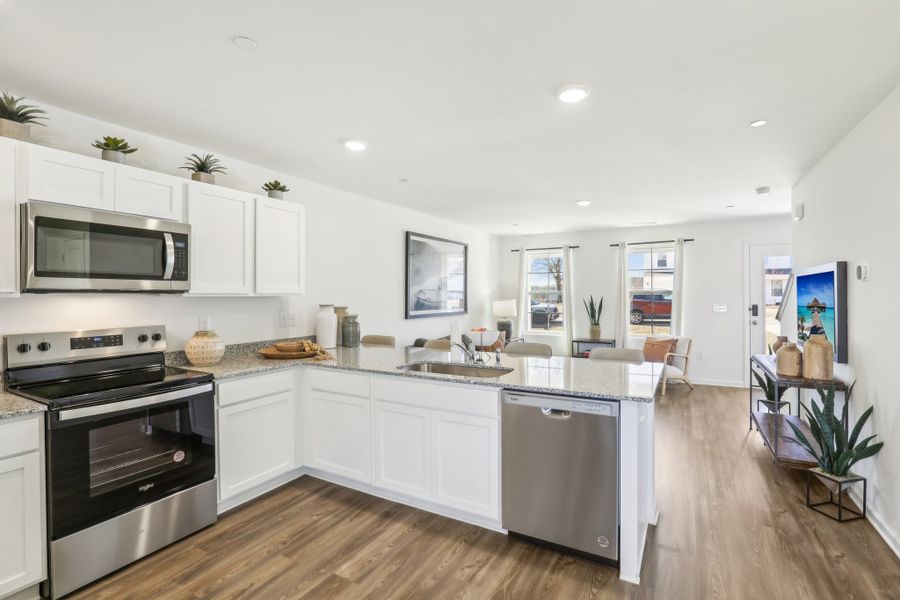 A kitchen with white cabinets. A kitchen with white cabinets.