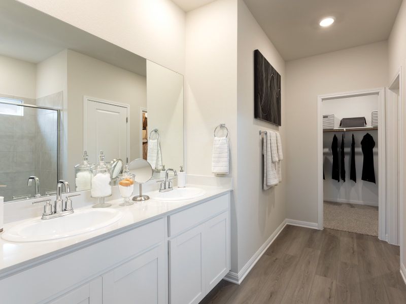 Plenty of counter space and an oversized shower in this luxurious primary bathroom.