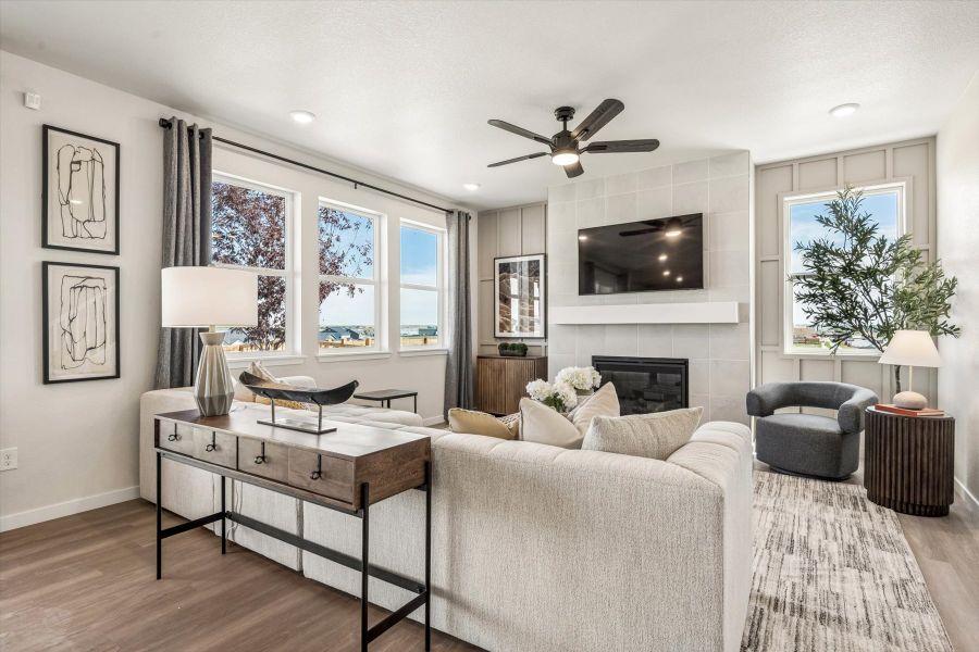 A living room with a large window. A living room with a large window.