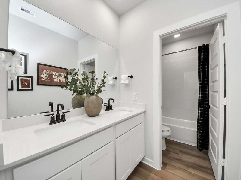 Furnished interior in a model home at Enclave at Newport in Crosby (Image 19).