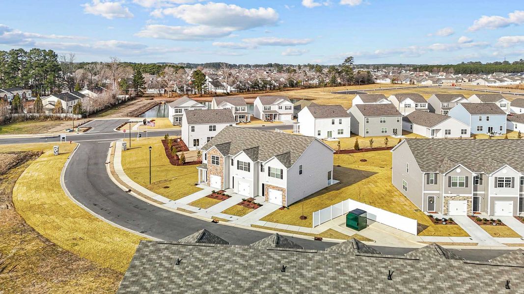 Aerial view of the The Townes at Ridgewood Farms community in Winterville, NC, showing layout and nearby surroundings (Image 10).