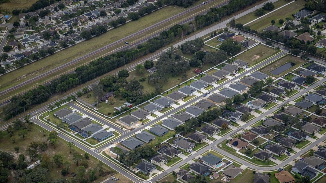Aerial view of the Whiting Estates community in Spring Hill, FL, showing layout and nearby surroundings (Image 7). Aerial view of the Whiting Estates community in Spring Hill, FL, showing layout and nearby surroundings (Image 7).