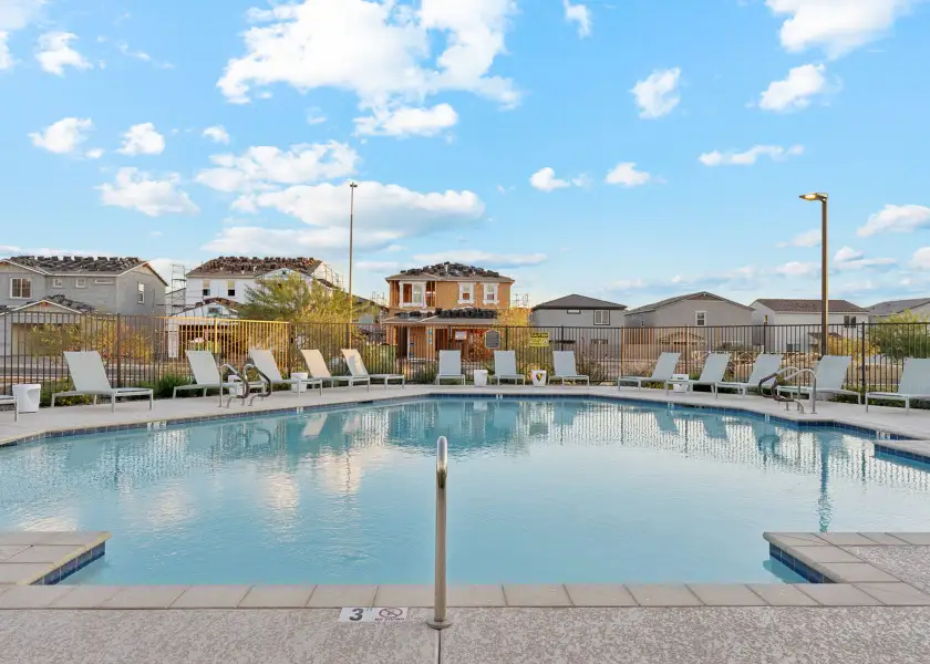 A pool with a fence around it. A pool with a fence around it.