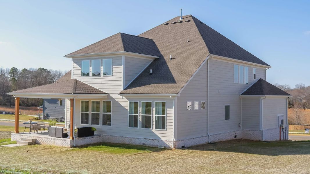 Elegant gable roof and expansive windows define this sophisticated Richvale Estates home.