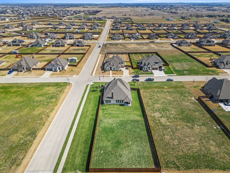 Aerial view of the Coyote Crossing community in Godley, TX, showing layout and nearby surroundings (Image 12).